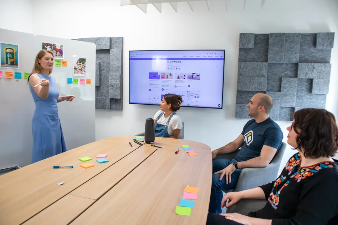 a group of people sitting around a conference table